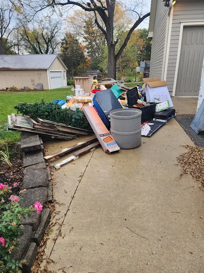 Dumpster being loaded with debris for Estate Cleanout Dumpster Rental in Kankakee